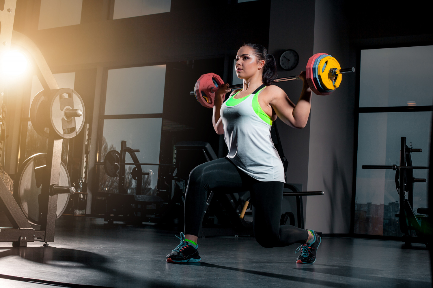 fit-young-woman-lifting-barbells-looking-focused-working-out-in-a-gym fit-young-woman-lifting-barbells-looking-focused-working-out-in-a-gym